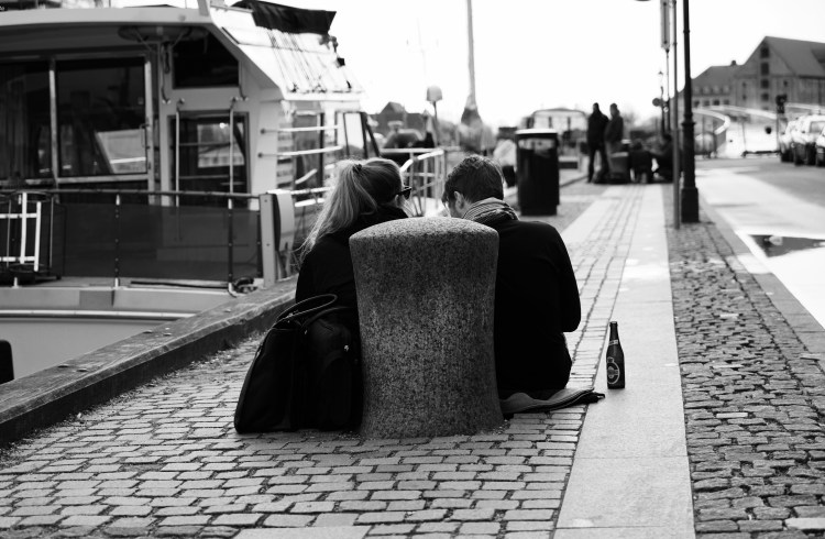 Two friends chilling by Nyhavn Harbour
